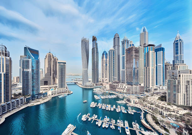 Skyline of modern skyscrapers and waterfront in Dubai, illustrating economic context for freelance visa costs.