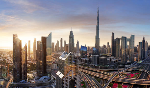 Panoramic view of Dubai's skyline at sunset, showcasing modern skyscrapers and bustling city life.